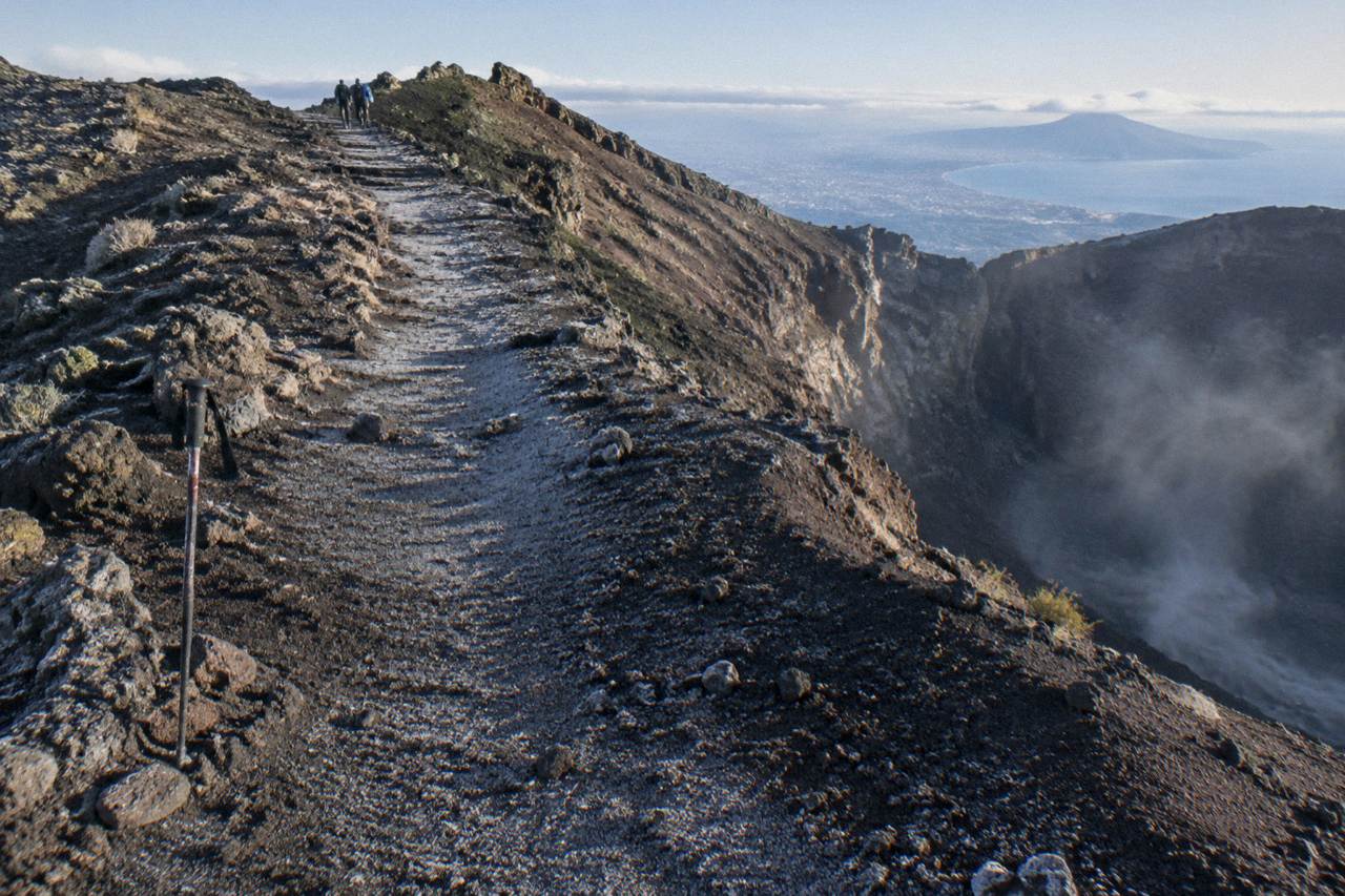The Gran Cono crater path of Vesuvius climbing through dark volcanic ash toward the crater rim