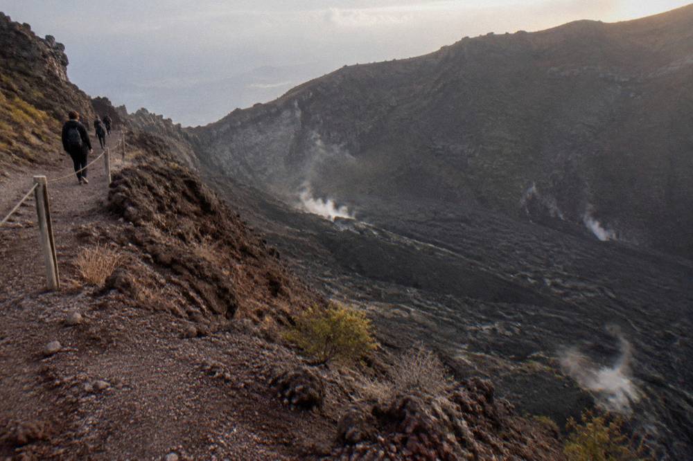 The interior slope of the Vesuvius crater with old lava flows and rising fumarole vapour
