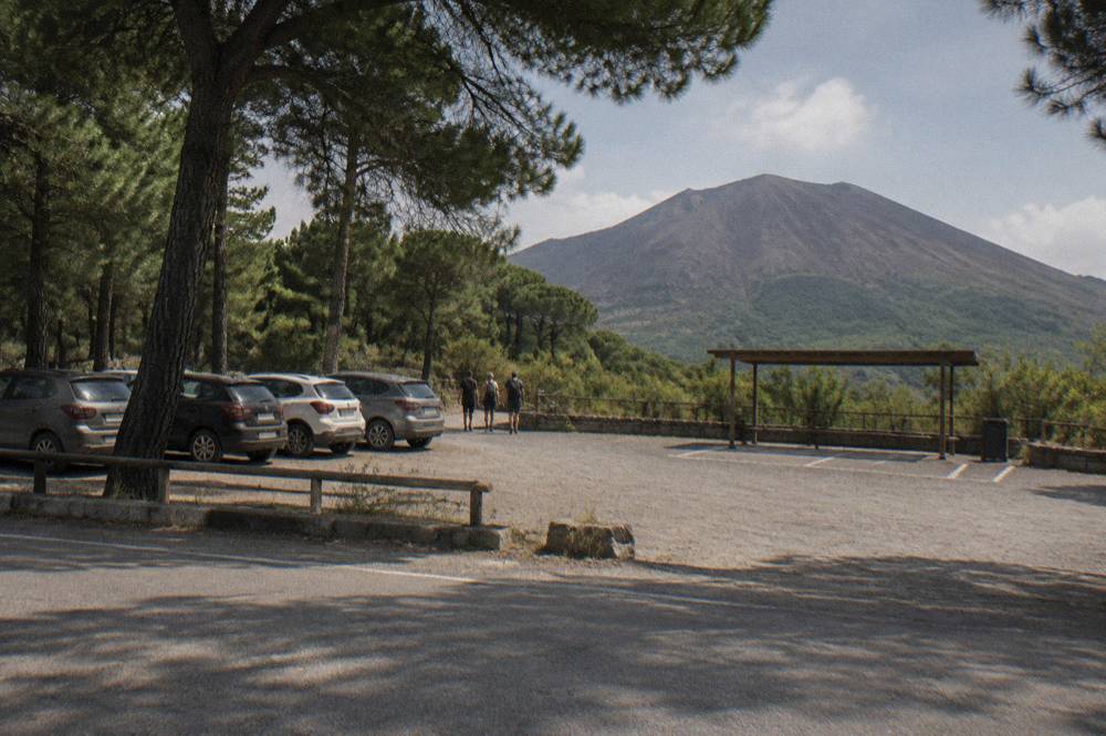 Parked cars along the winding provincial road below the Vesuvius trailhead