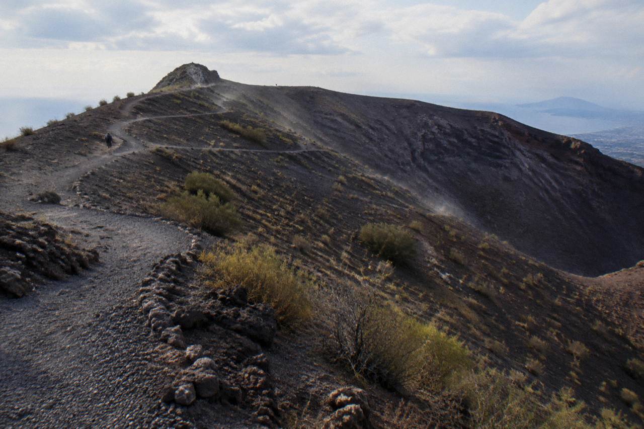 The Gran Cono crater path of Mount Vesuvius winding up through dark volcanic ash toward the rim.