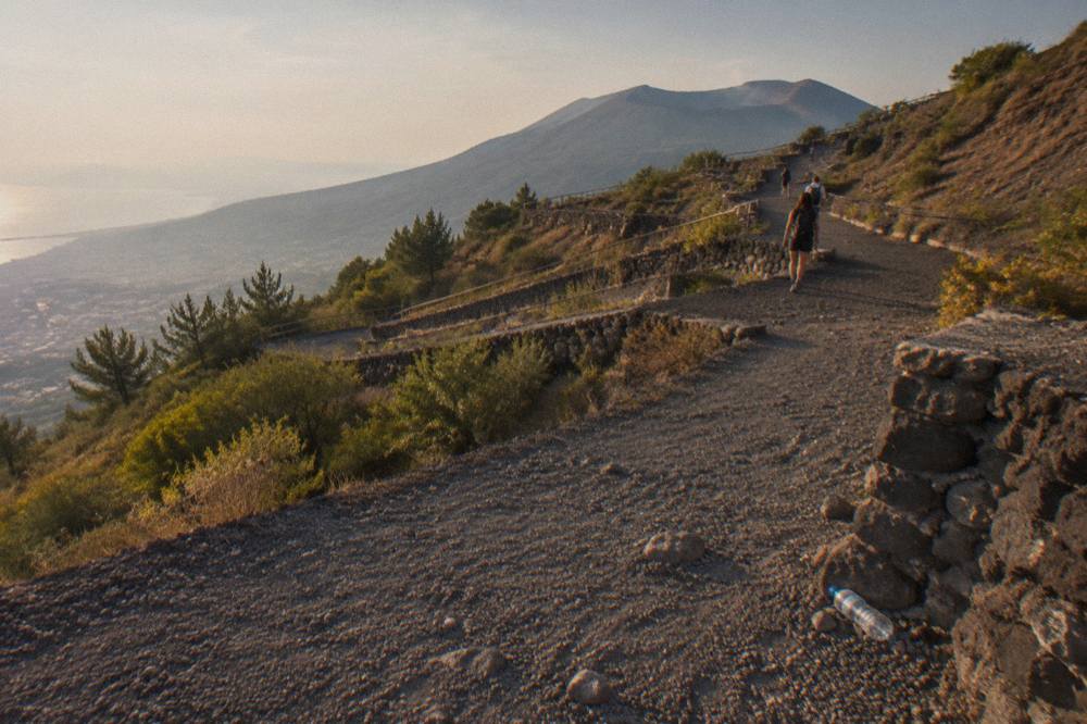 Volcanic gravel path winding up the slope of Mount Vesuvius toward the crater rim