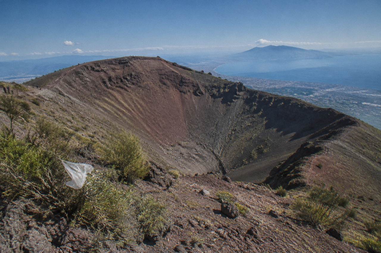 The crater of Mount Vesuvius under a blue sky