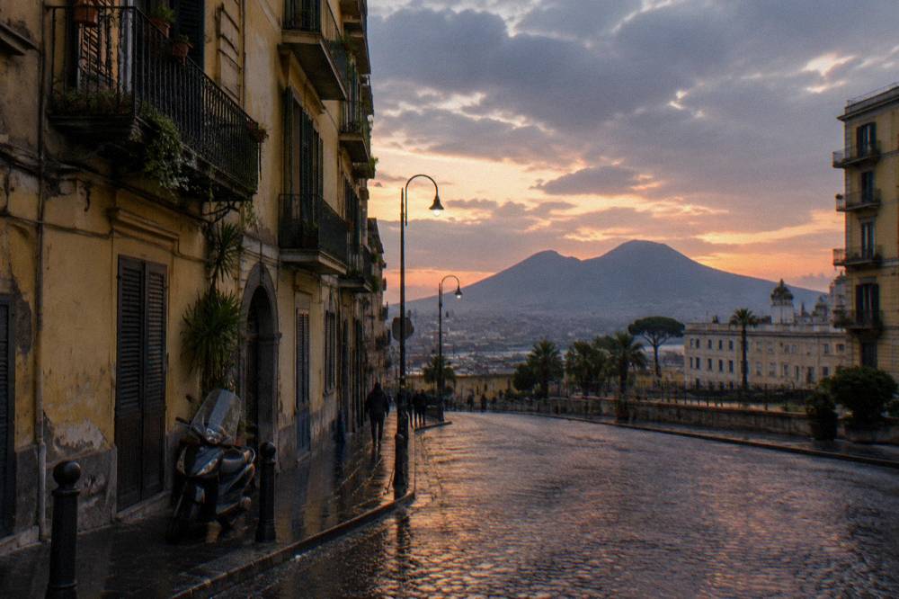Old stone buildings of central Naples with the silhouette of Vesuvius on the horizon