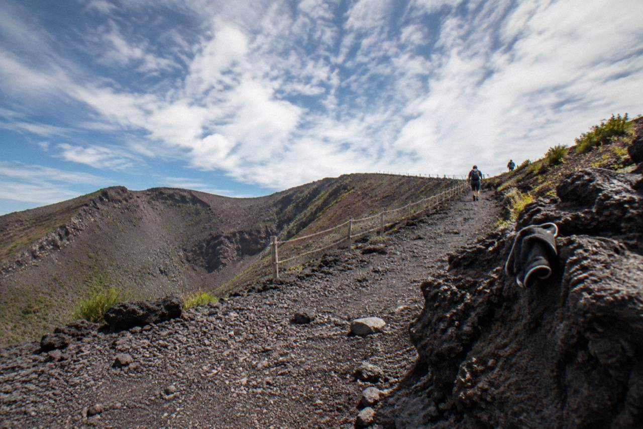 The Gran Cono crater path on Mount Vesuvius winding up through dark volcanic rock under a wide sky