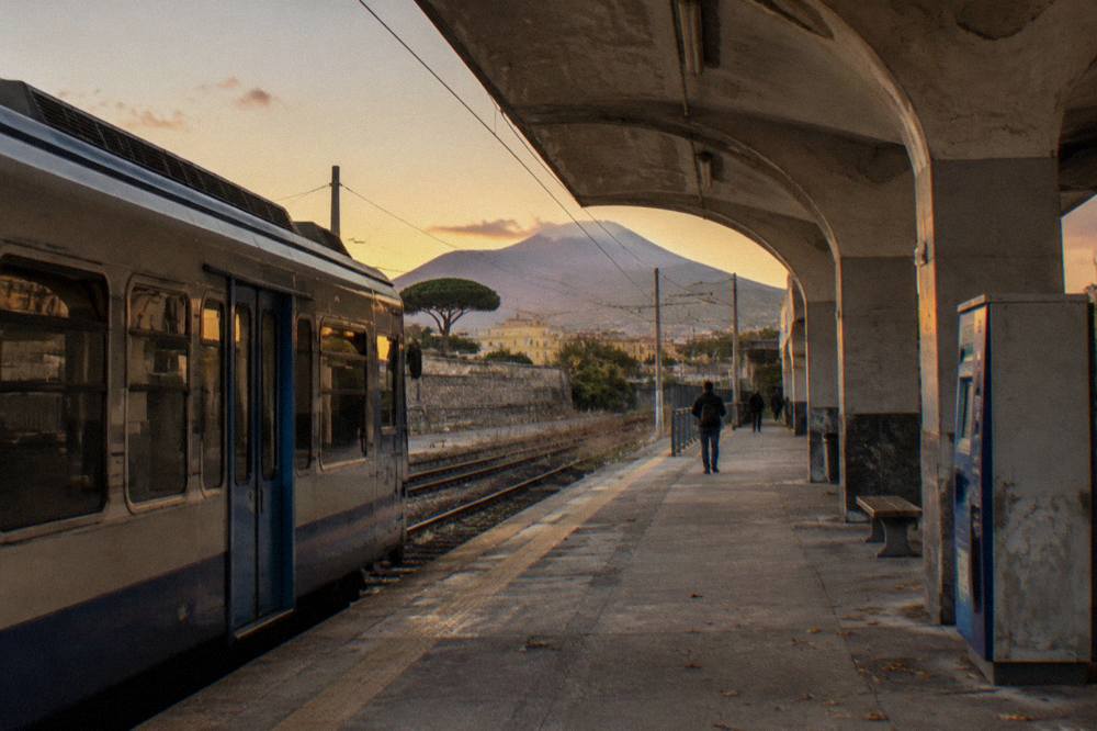 The Circumvesuviana platform at a station near Naples with a train waiting