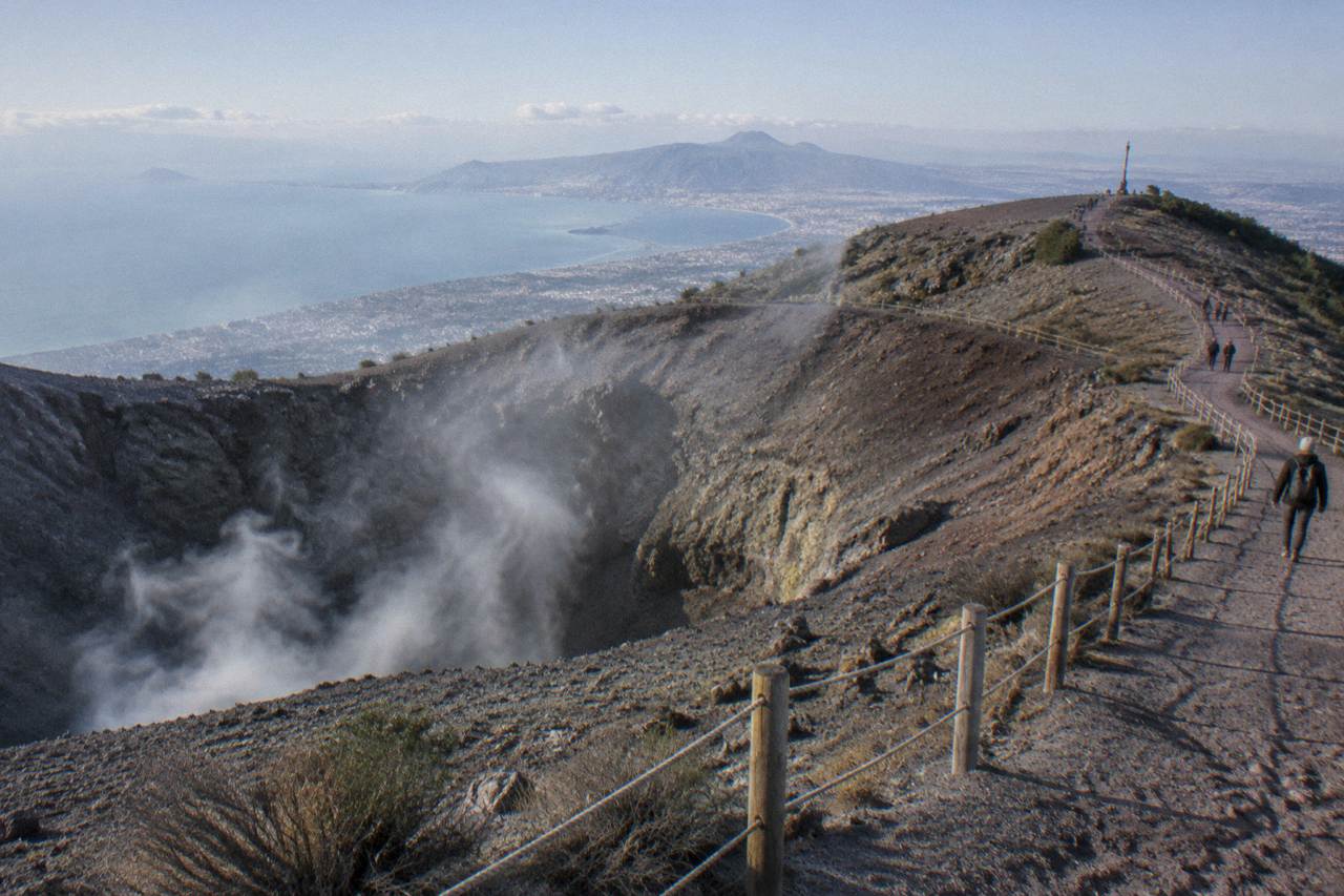 The Gran Cono crater path on Mount Vesuvius under a clear sky above the Bay of Naples