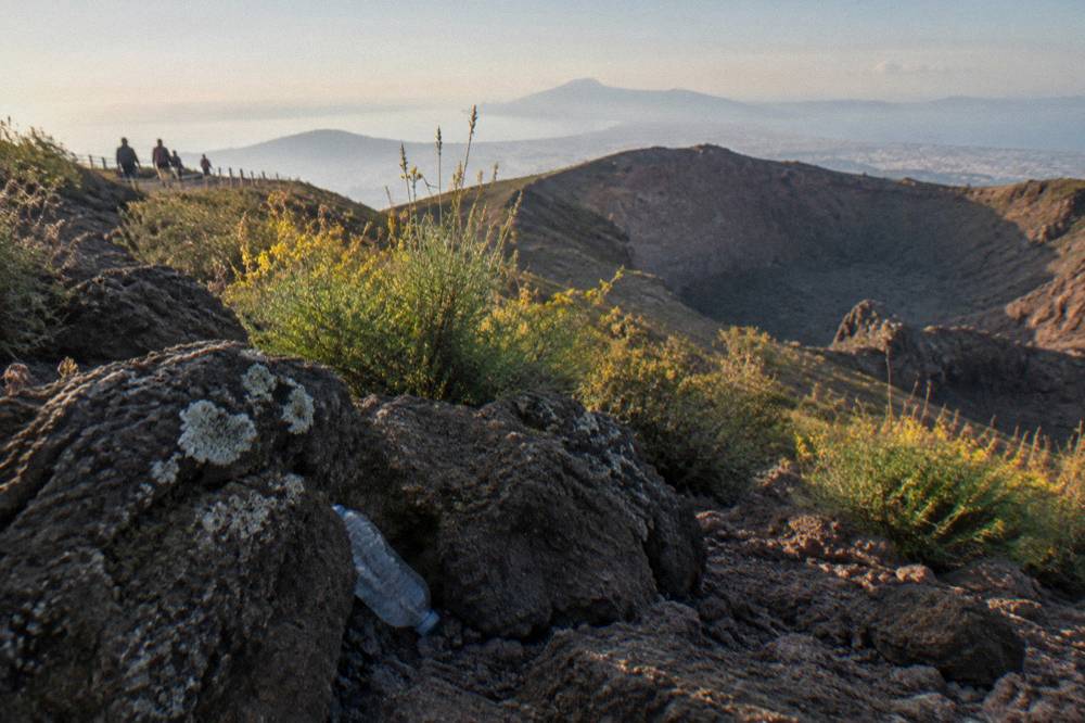 Solidified 1944 lava flow rock on the slopes of Vesuvius covered in scrub vegetation