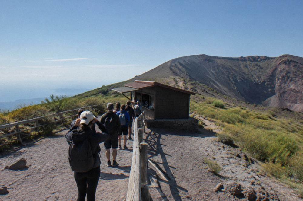 A park ticket hut on the Vesuvius trail with hikers queueing