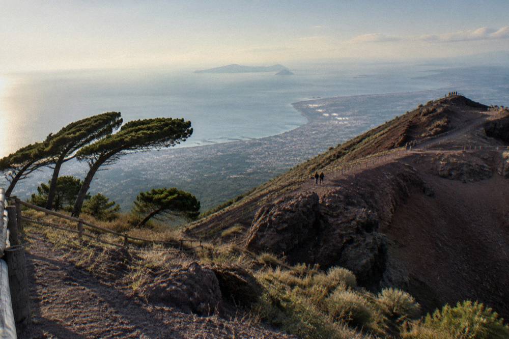 Coastal panorama from a volcanic ridge with sea, islands and towns in haze