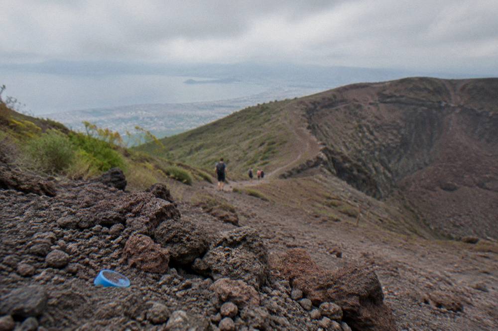 A short crater trail walk on Mount Vesuvius with volcanic rock underfoot and hikers in the distance