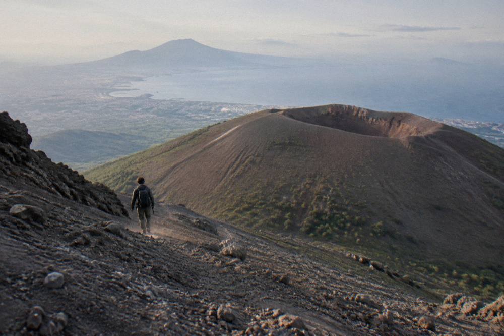The summit cone of Vesuvius seen from the upper slopes with the bay in the distance