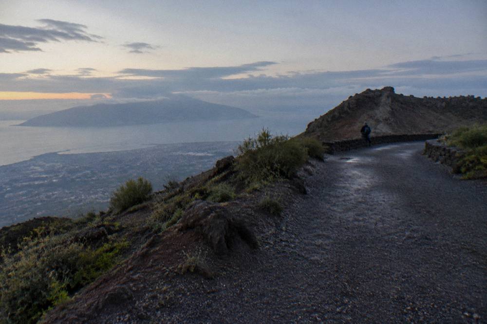 A quiet stretch of the Vesuvius trail in soft morning light with the path curving toward the ridge