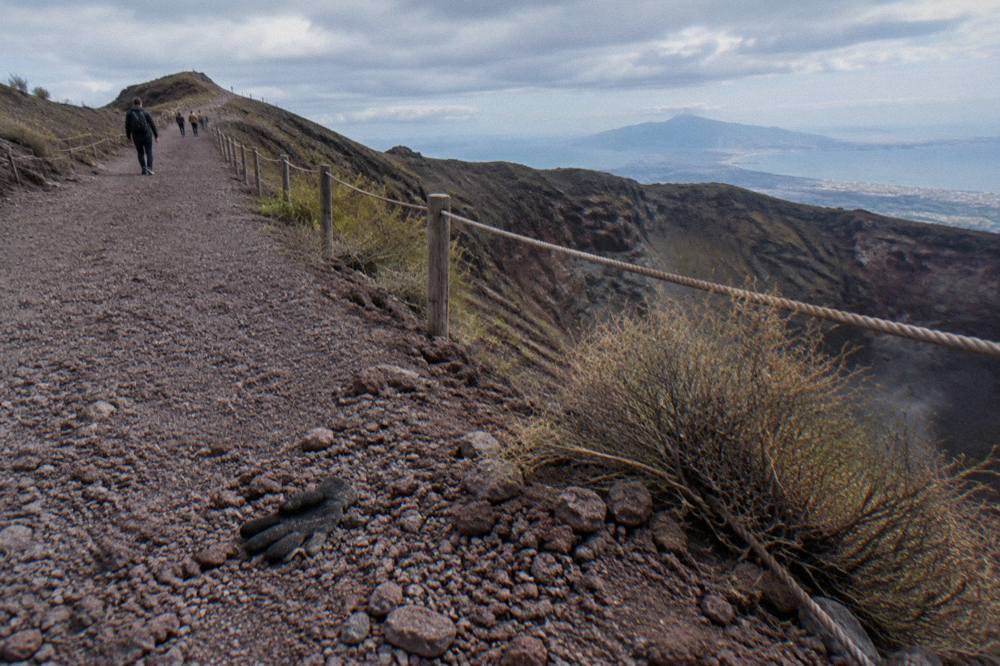 The gravel crater path of the Gran Cono trail rising toward the Vesuvius crater rim