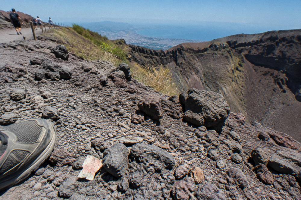 Volcanic gravel and loose rock surface of the Gran Cono path under strong sun