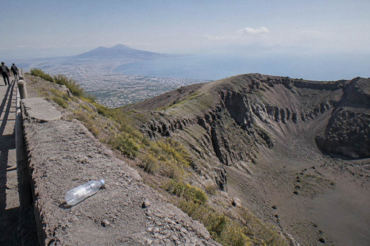 The Gran Cono crater of Vesuvius under a clear sky above the Bay of Naples
