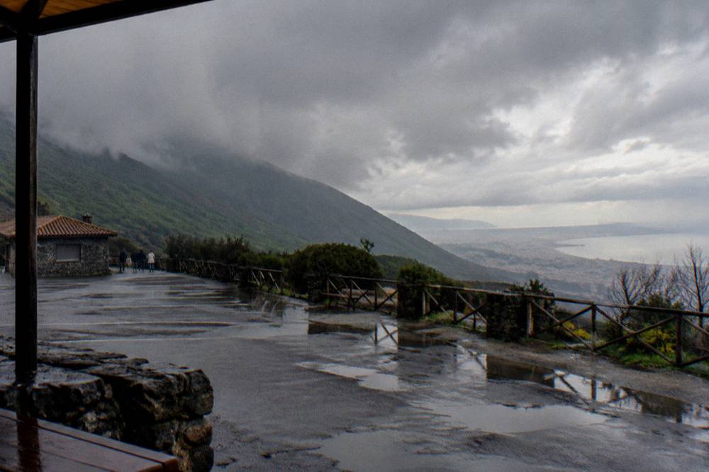 Cloud and rain sweeping across the Vesuvius slopes above the Bay of Naples