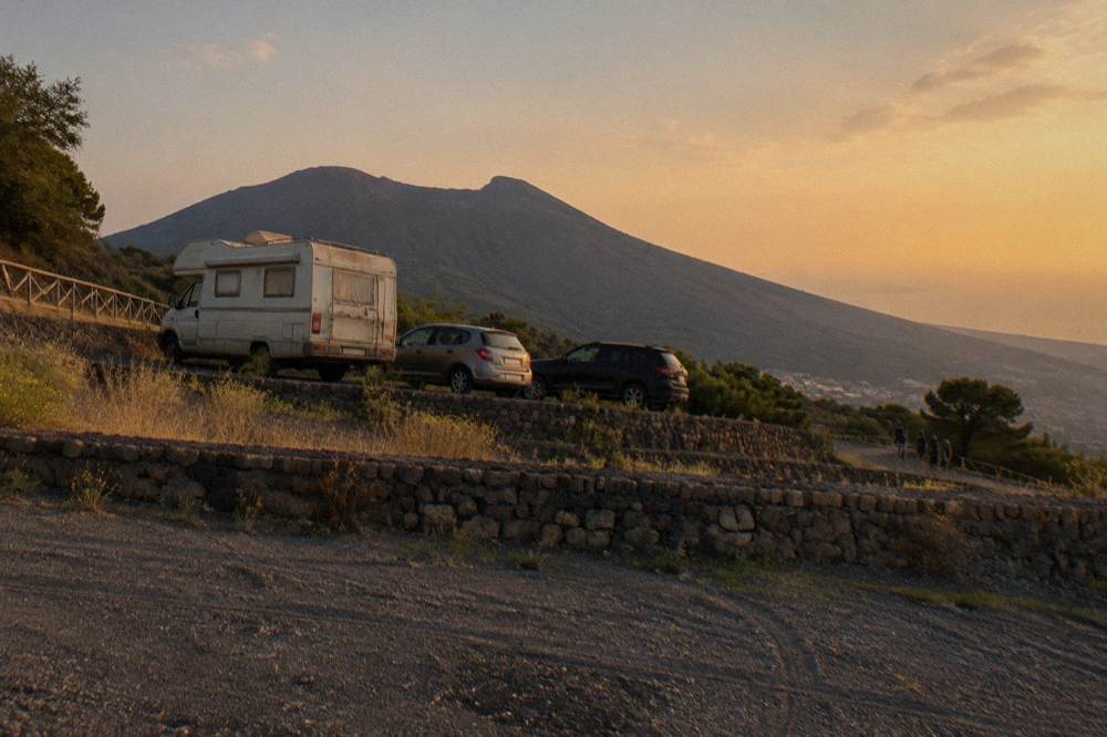 Roadside parking bays carved into the volcanic hillside below Vesuvius