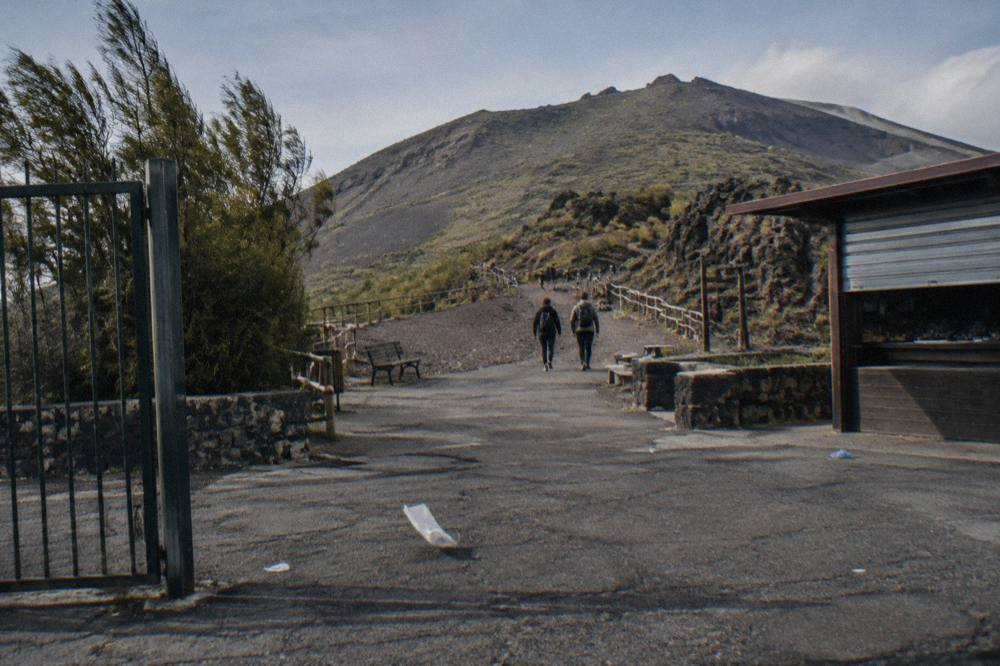 The Quota 1000 plaza with the ash-covered crater path climbing toward the ridge above