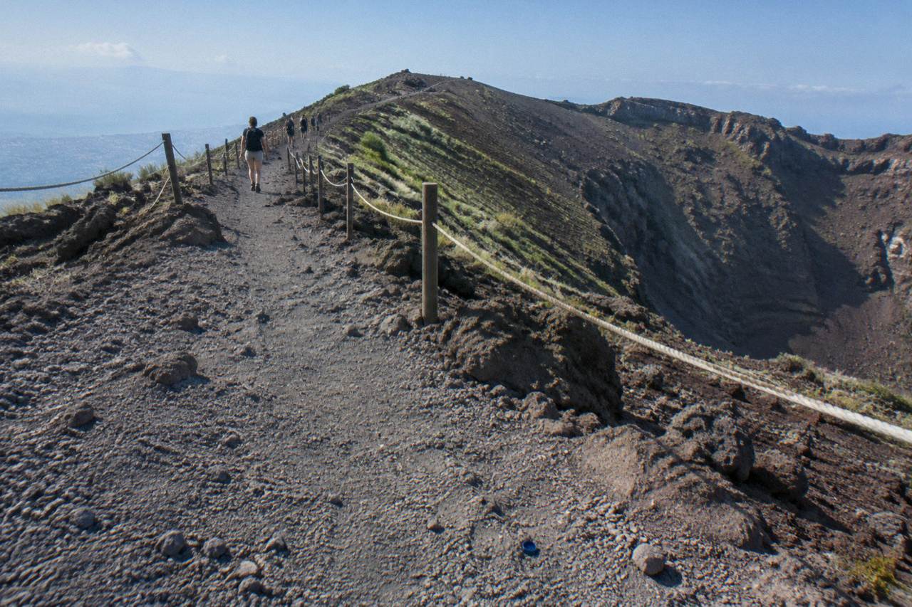The Gran Cono crater path rising through volcanic ash toward the Vesuvius summit ridge