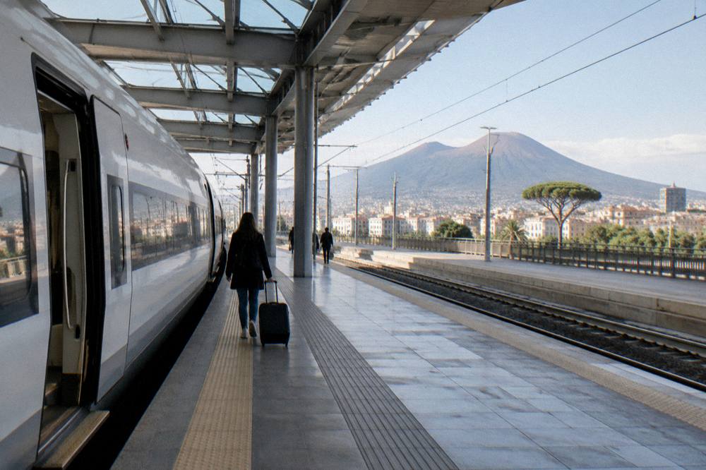 Fast train stopped at a station platform in morning light
