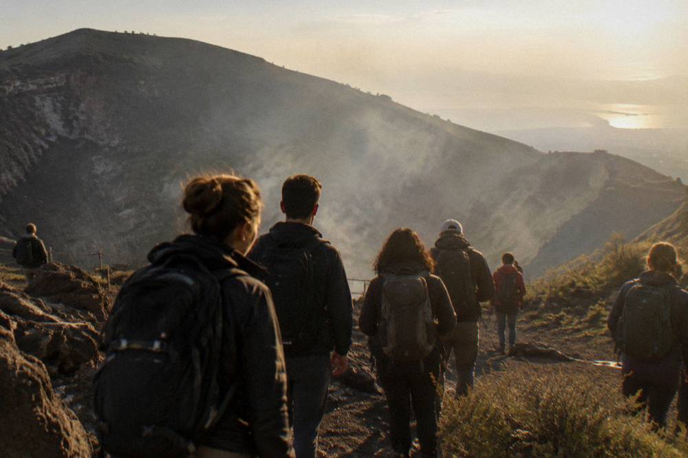 A shared tour group gathered on the crater rim of Vesuvius