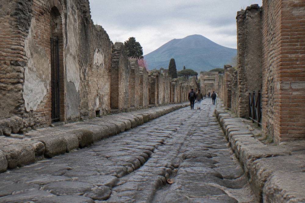 Cobblestone street between ancient walls in the Pompeii excavations
