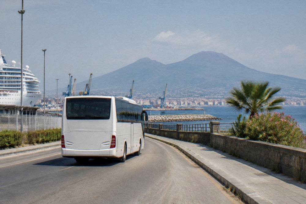 Coach transferring passengers along the road to the Vesuvius National Park entrance