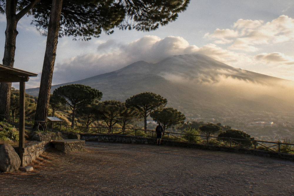 Clouds drifting across the Vesuvius slopes above pine woodland in late afternoon light