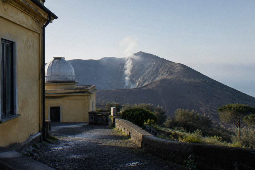 Steam rising from fumaroles on the inner wall of the Vesuvius crater in morning light