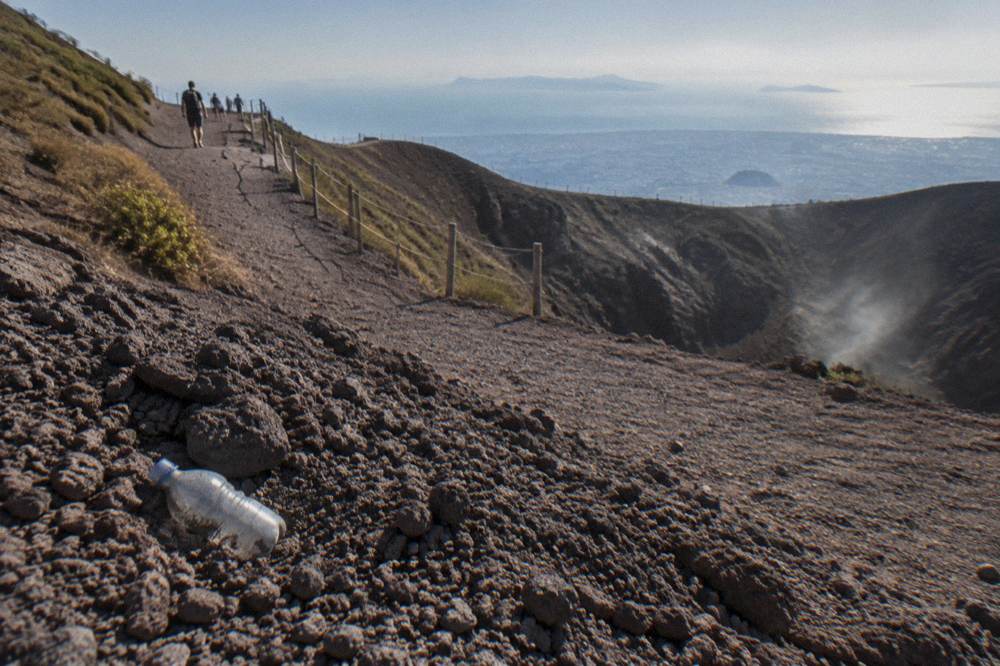 A broad gravel path switchbacking up the dark volcanic slopes of Vesuvius
