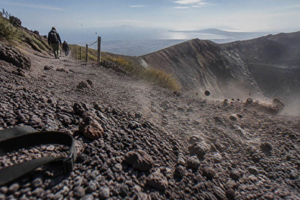 Close view of the loose grey volcanic gravel surface of the Vesuvius trail